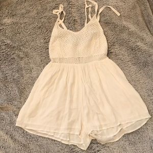 White Romper with neck tie halter.